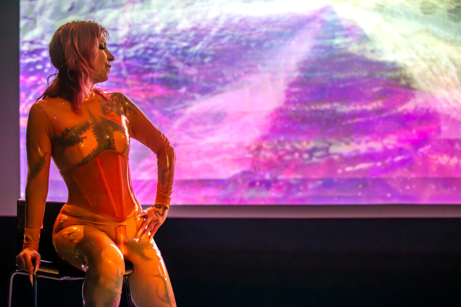 Libby Heaney performs a new iteration of Eat My Multiverse, MU Year's Toast, MU Hybrid Art House, Eindhoven, February 2026. Photo: Hanekke Wetzer.