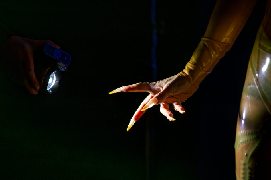 Libby Heaney performs a new iteration of Eat My Multiverse, MU Year's Toast, MU Hybrid Art House, Eindhoven, February 2026. Photo: Hanekke Wetzer.