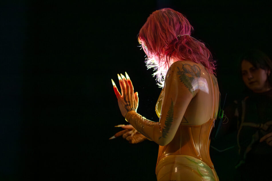 Libby Heaney performs a new iteration of Eat My Multiverse, MU Year's Toast, MU Hybrid Art House, Eindhoven, February 2026. Photo: Hanekke Wetzer.