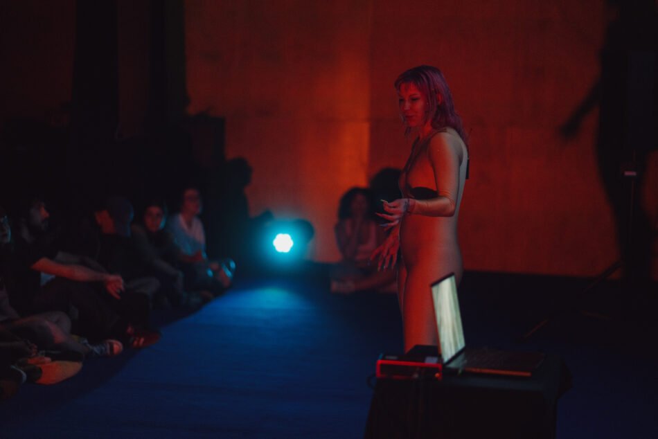 Libby Heaney performing the fourth iteration of Eat My Multiverse at Porto Art School, Porto, 2026. Photo: Miguel De.