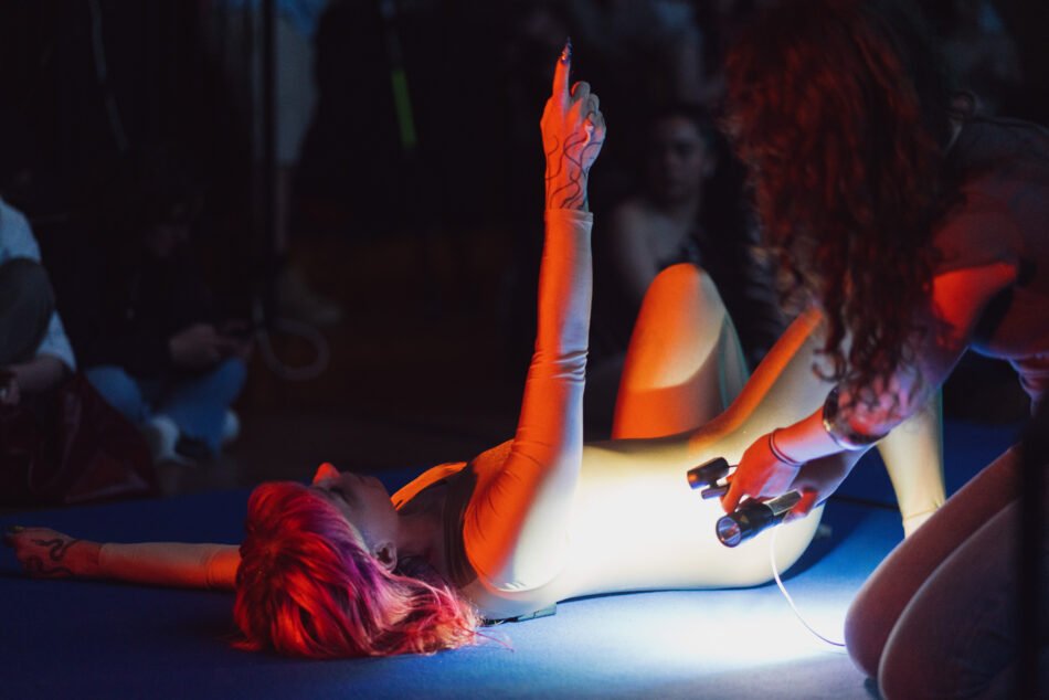 Libby Heaney performing the fourth iteration of Eat My Multiverse at Porto Art School, Porto, 2026. Photo: Miguel De.