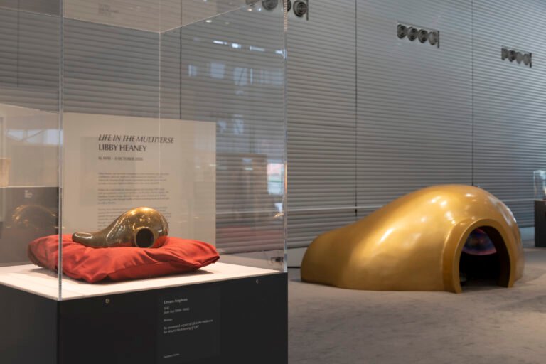 Installation view: [Left] Jean Arp, Dream Amphora, 1941. [Right] Libby Heaney, Life in the Multiverse, 2026, housed inside giant replica of Arp's Dream Amphora. Sainsbury Centre, Norwich, 16th May - 4th October 2026.Photo: Kate Wolstenholme.